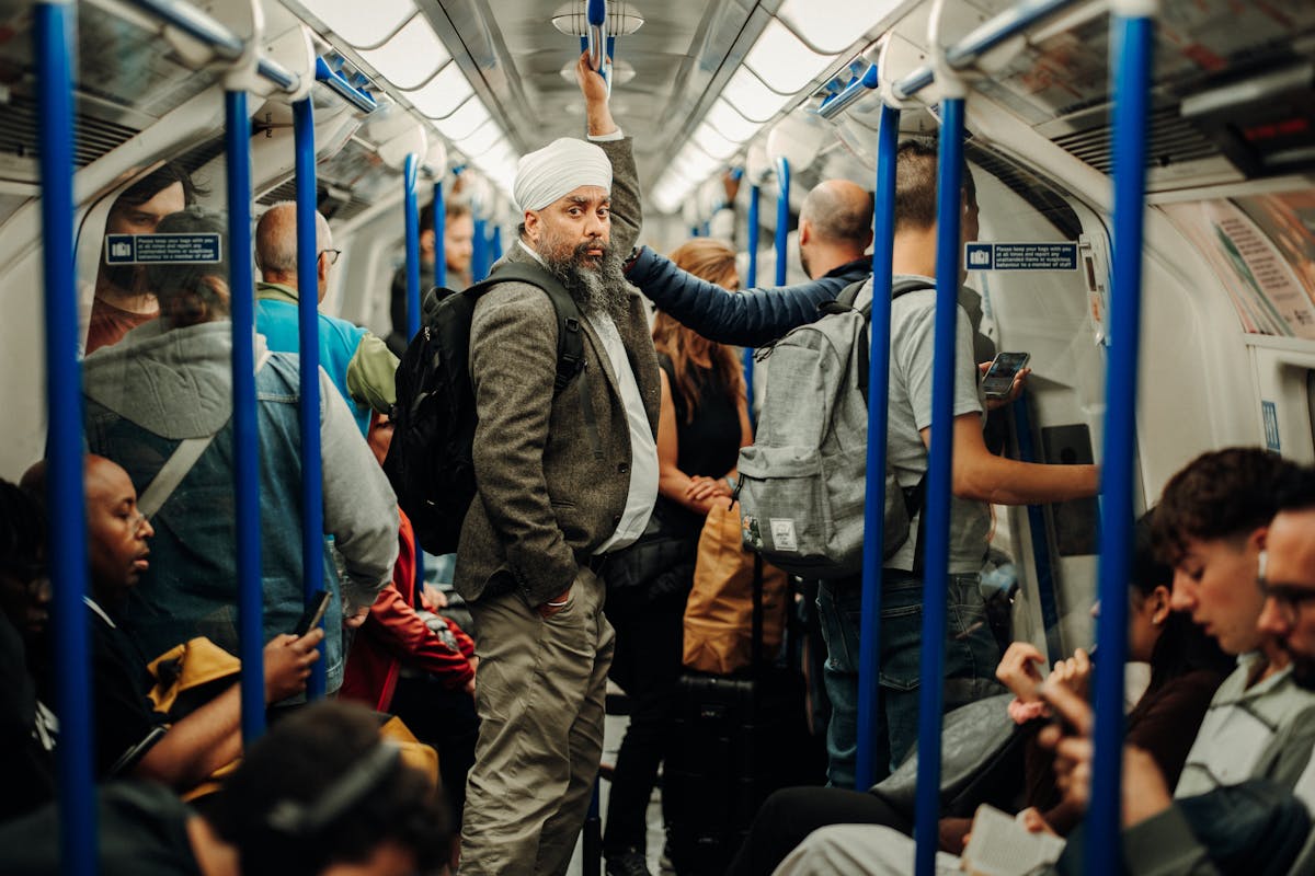 Commuters on a London Underground subway train